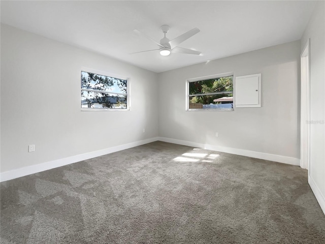 carpeted empty room with electric panel and ceiling fan