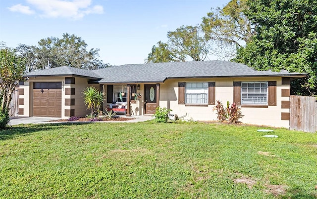 view of front of property featuring a garage and a front yard