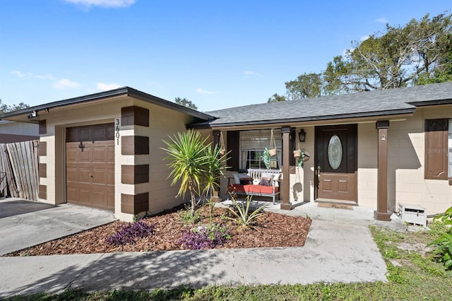 single story home featuring a garage