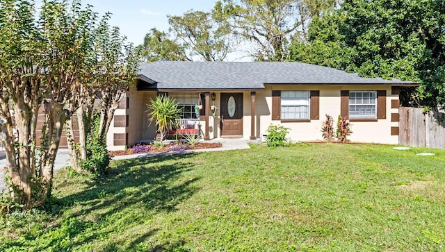 ranch-style house with a front yard