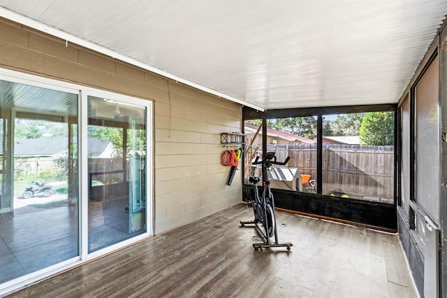 workout area featuring hardwood / wood-style floors