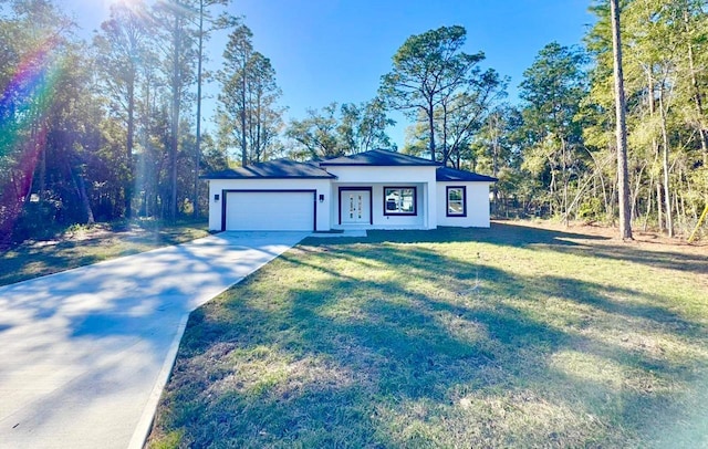 single story home with a front yard and a garage