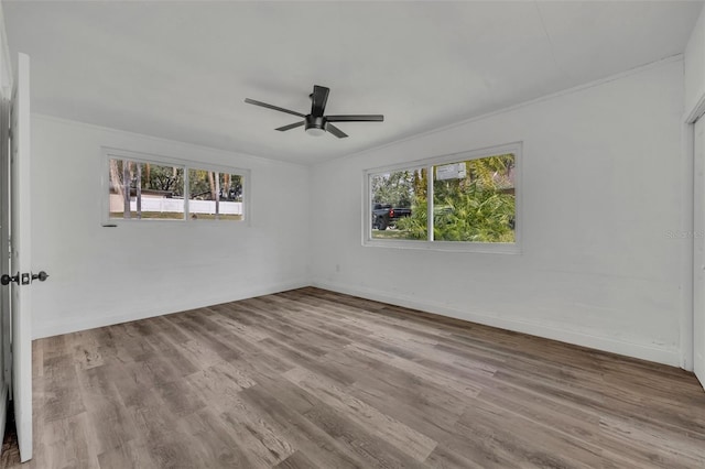 unfurnished room featuring crown molding, ceiling fan, and light hardwood / wood-style floors
