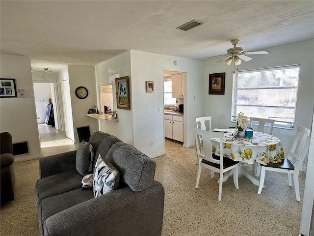 living room featuring ceiling fan