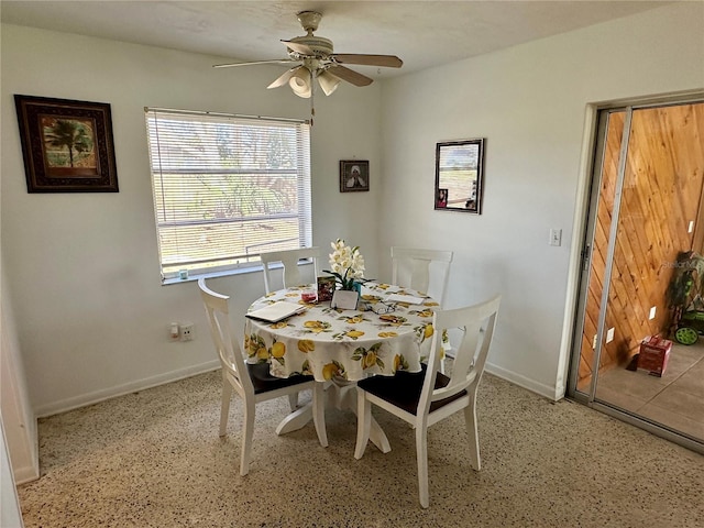 dining space with ceiling fan