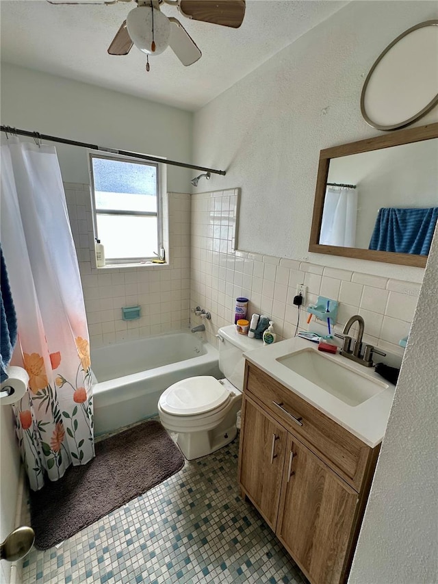 full bathroom featuring vanity, tile patterned flooring, toilet, shower / bathtub combination with curtain, and tile walls