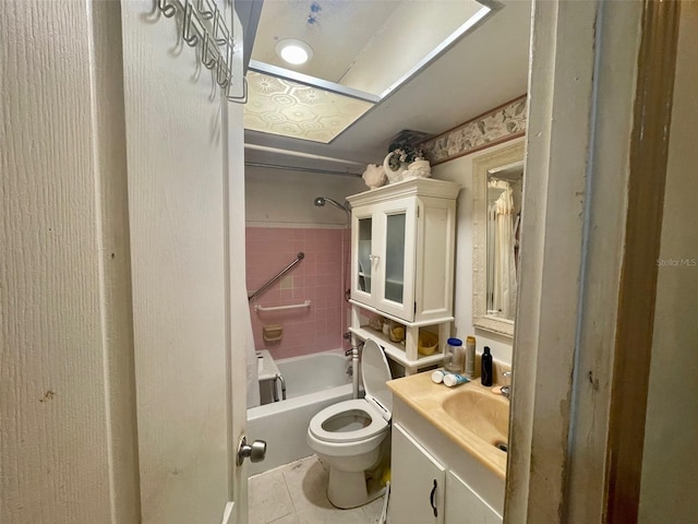 full bathroom with toilet, tile patterned flooring, vanity, and tiled shower / bath