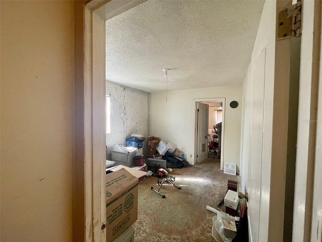 miscellaneous room featuring a textured ceiling