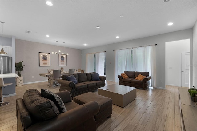 living room with an inviting chandelier