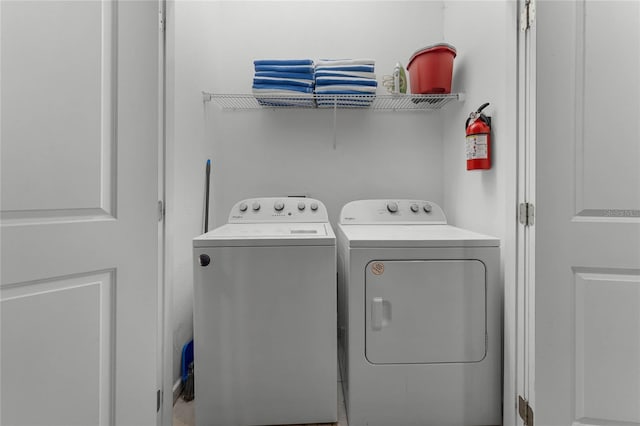 laundry area with independent washer and dryer