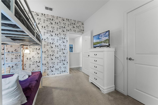 bedroom featuring light carpet