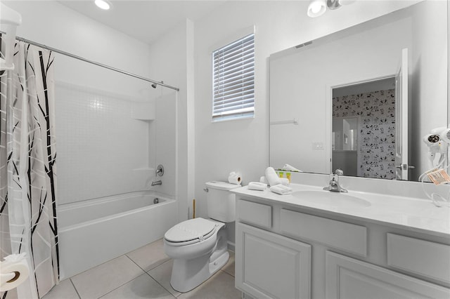 full bathroom featuring toilet, vanity, tile patterned floors, and shower / bathtub combination with curtain