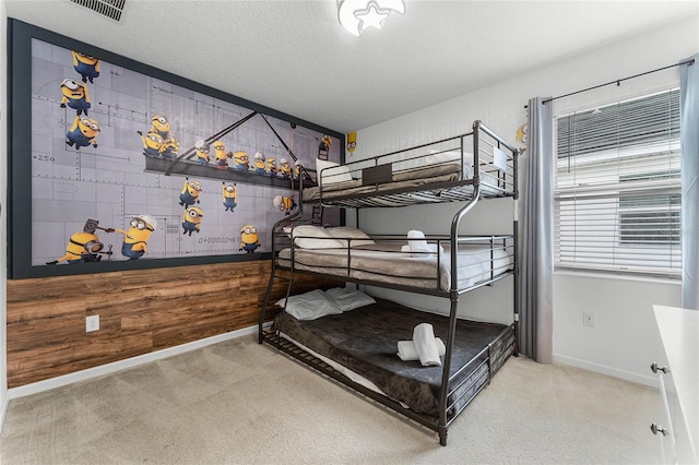 carpeted bedroom with a textured ceiling