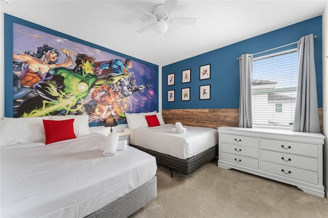 carpeted bedroom featuring ceiling fan