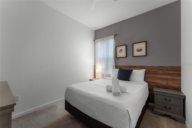 carpeted bedroom featuring ceiling fan and lofted ceiling