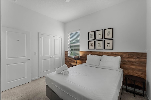 carpeted bedroom featuring a closet