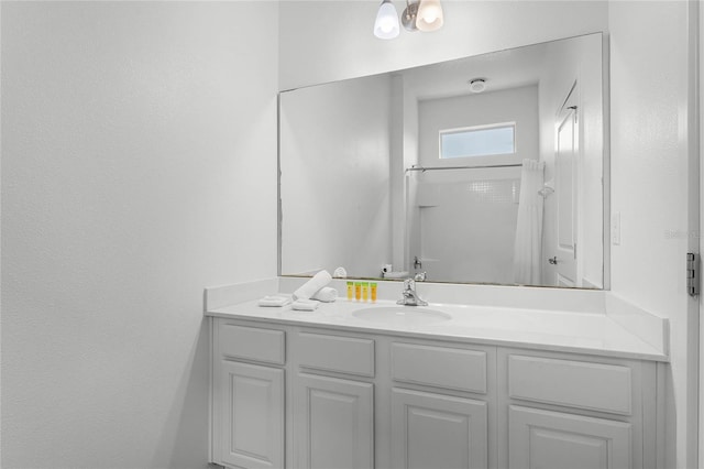 bathroom with vanity and walk in shower