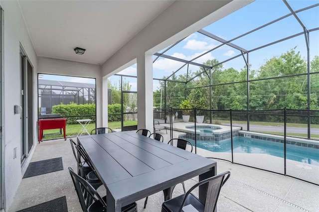 view of swimming pool featuring a lanai, an in ground hot tub, and a patio