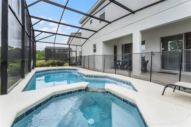 view of pool featuring a lanai and a patio