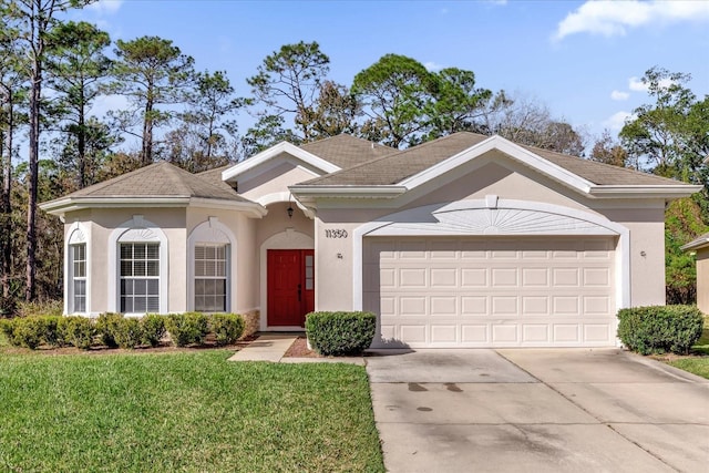 ranch-style house with a garage and a front yard