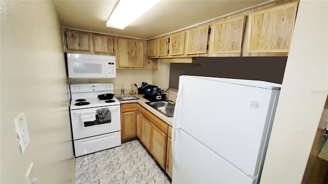 kitchen featuring sink and white appliances