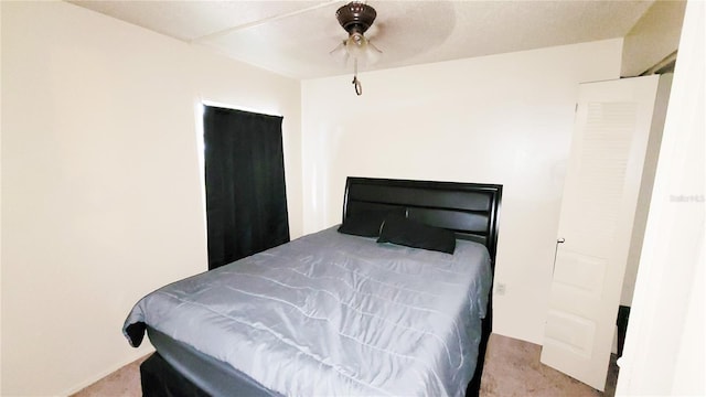 bedroom featuring ceiling fan and light colored carpet