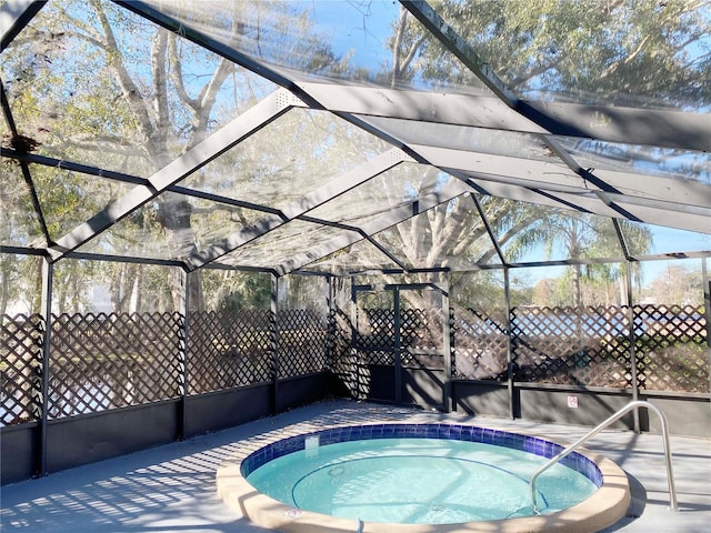 view of swimming pool featuring a hot tub