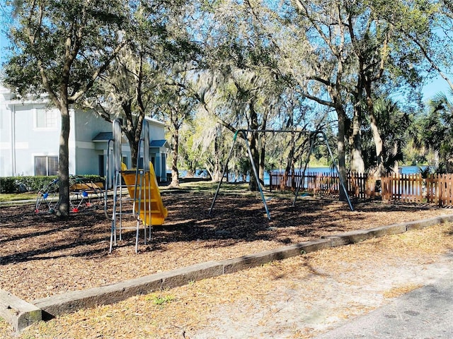 view of jungle gym with a water view