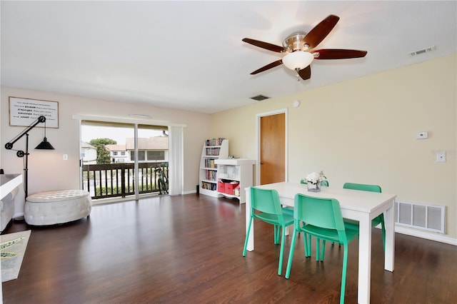 dining area with ceiling fan and dark wood-type flooring