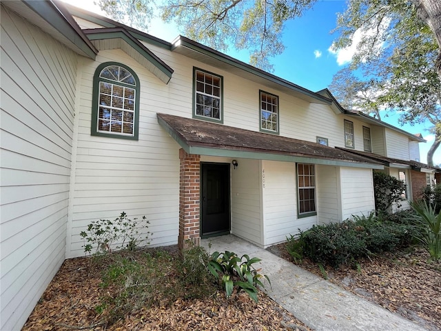 view of front of home featuring brick siding