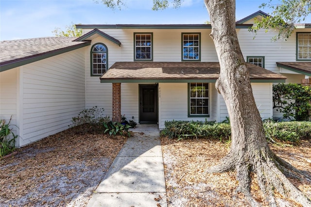 view of front of home with a shingled roof