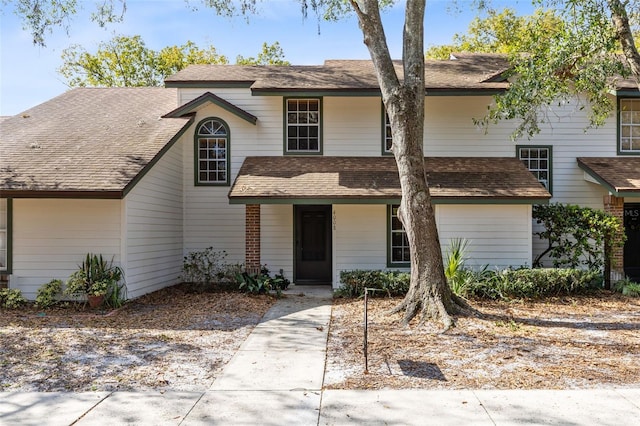 view of front of home with a shingled roof