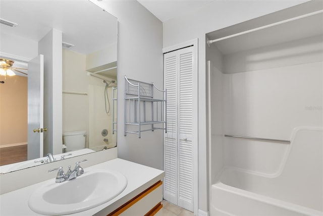 full bath with a closet, shower / bathing tub combination, vanity, and toilet