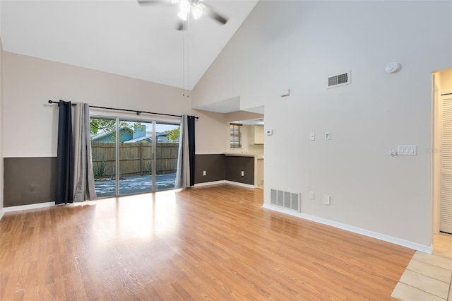 unfurnished living room with light wood-style floors, ceiling fan, visible vents, and baseboards