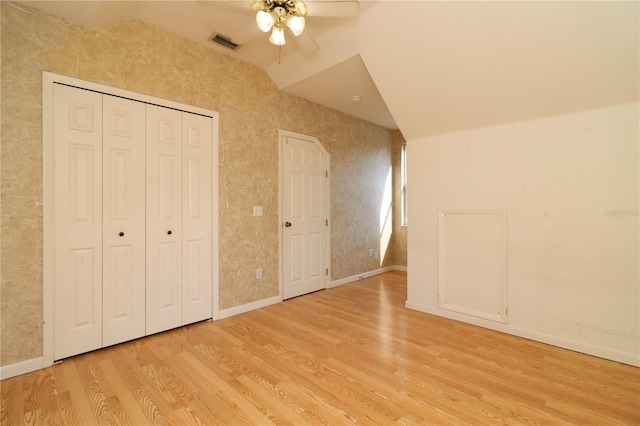 additional living space with lofted ceiling, ceiling fan, and light wood-type flooring