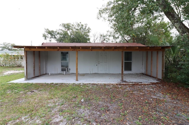 rear view of property featuring a patio area