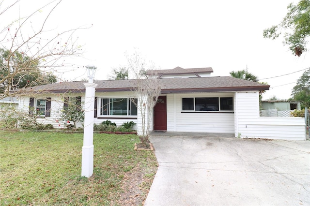 ranch-style house with a front yard