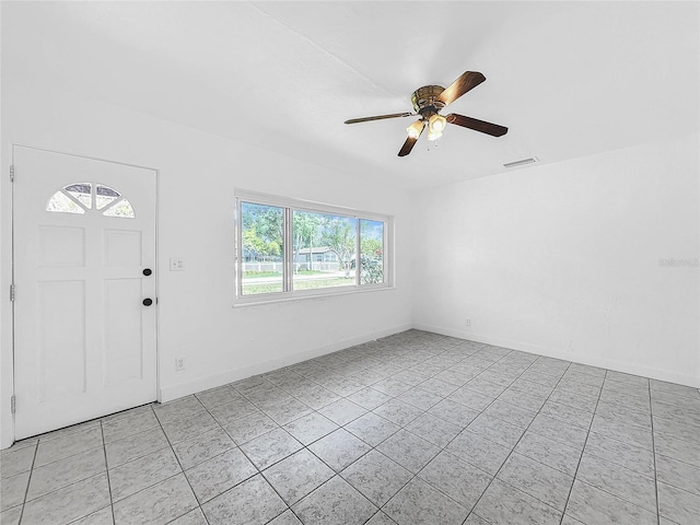 entryway featuring light tile patterned floors and ceiling fan