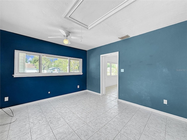 unfurnished room with light tile patterned floors and ceiling fan