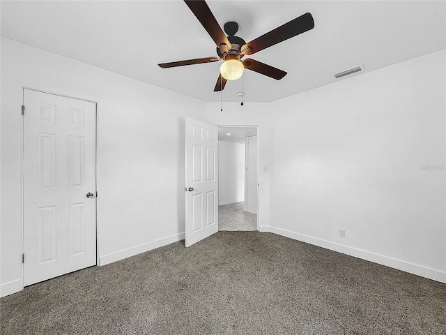 unfurnished bedroom with carpet floors and ceiling fan