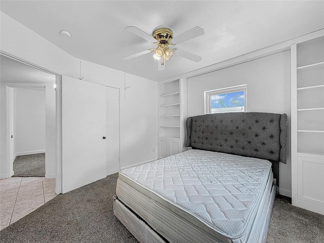 bedroom with dark carpet and ceiling fan