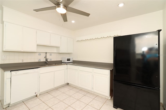 kitchen featuring white appliances, sink, decorative backsplash, and white cabinets