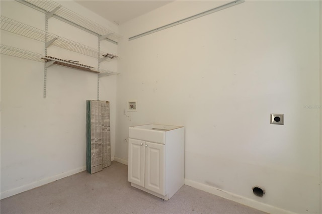 clothes washing area with cabinets, electric dryer hookup, and hookup for a washing machine