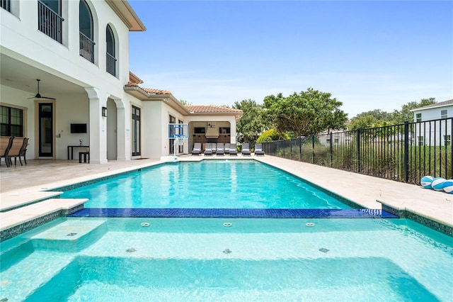 view of swimming pool featuring an in ground hot tub, ceiling fan, and a patio area