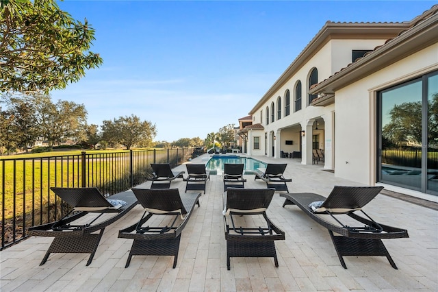 view of patio featuring a fenced in pool