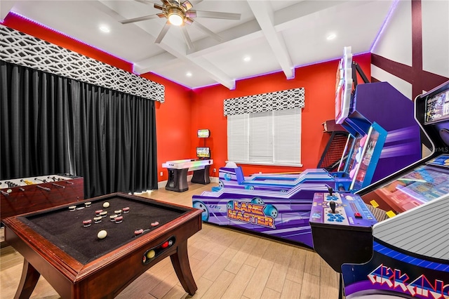 rec room with hardwood / wood-style flooring, ceiling fan, beamed ceiling, and coffered ceiling