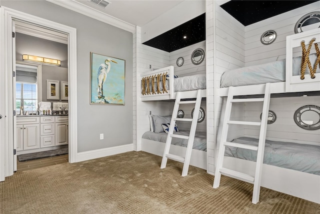 bedroom featuring carpet flooring and crown molding