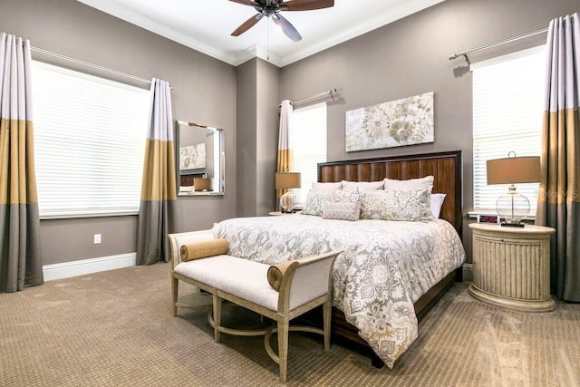 bedroom featuring ceiling fan, carpet floors, and crown molding