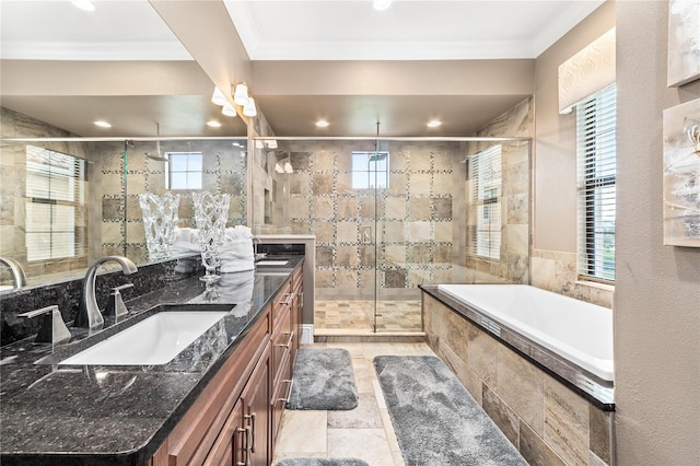 bathroom featuring vanity, separate shower and tub, and ornamental molding