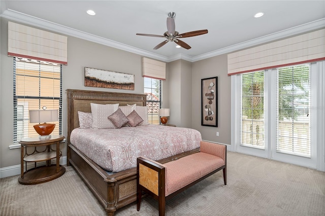 bedroom featuring carpet flooring, ceiling fan, and crown molding